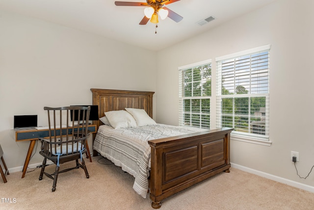 bedroom featuring ceiling fan and light colored carpet