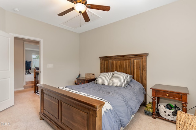 bedroom featuring light colored carpet and ceiling fan