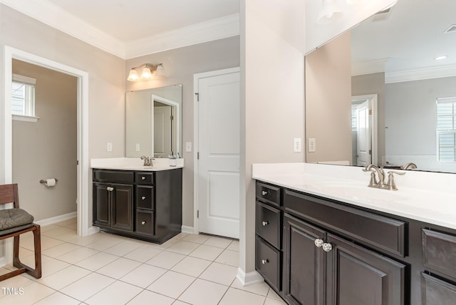 1329 Endgame Ct, Wake Forest, NC 27587 - full bathroom featuring ornamental molding, two vanities, tile patterned floors, and baseboards