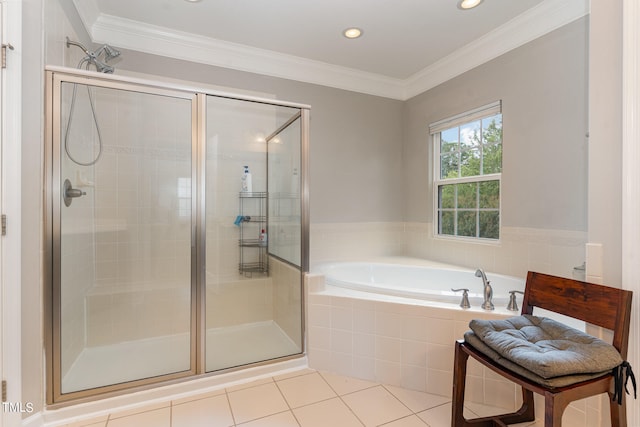 bathroom with tile floors, ornamental molding, and shower with separate bathtub