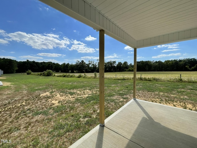 view of yard with a patio area and a rural view