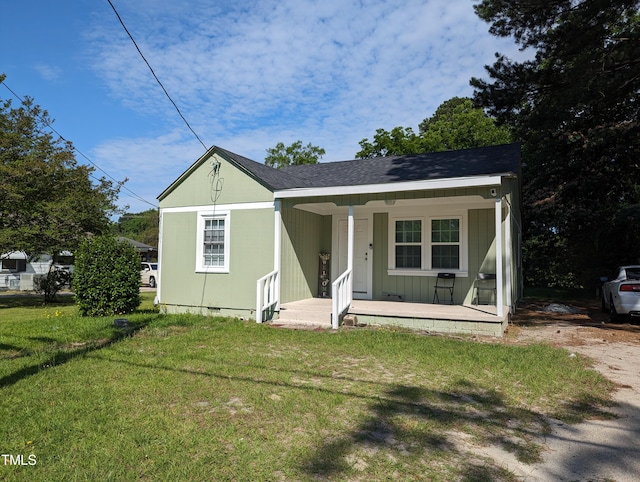 bungalow-style house with a porch and a front lawn