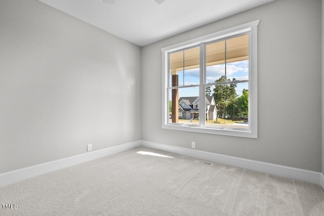 unfurnished room featuring carpet