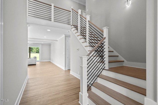 staircase with wood-type flooring