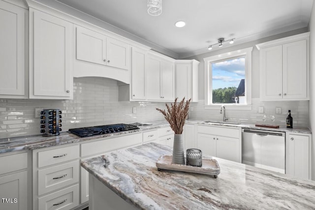 kitchen with white cabinetry, stainless steel dishwasher, black gas cooktop, and sink