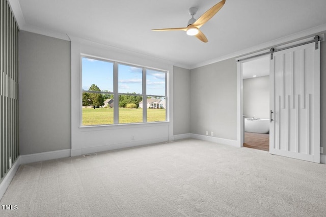 unfurnished bedroom with ceiling fan, ornamental molding, and carpet floors