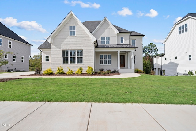 view of front of house with a front lawn and covered porch