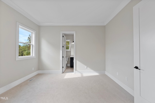 carpeted spare room with ornamental molding