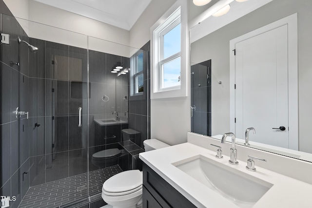 bathroom featuring vanity, toilet, and walk in shower