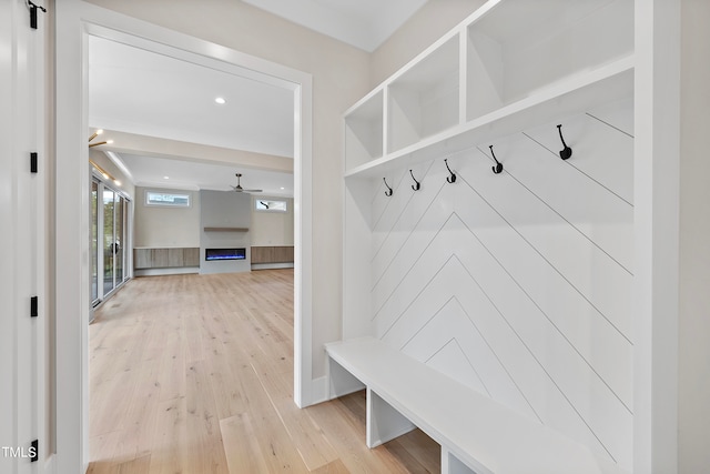 mudroom featuring ceiling fan and light wood-type flooring