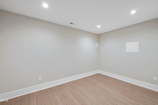 spare room with light hardwood / wood-style flooring