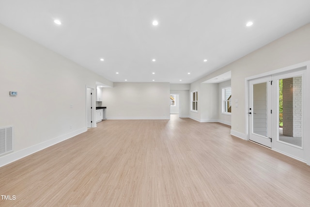 unfurnished living room with light hardwood / wood-style floors