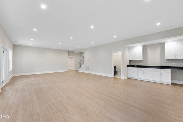 unfurnished living room featuring light hardwood / wood-style floors