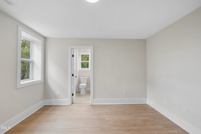 spare room featuring light hardwood / wood-style flooring