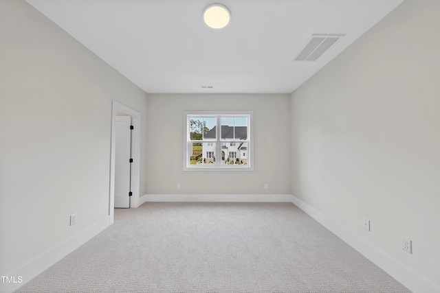 empty room with light colored carpet