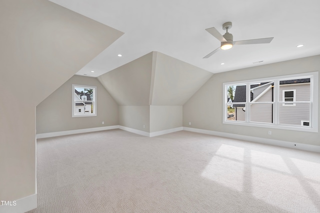 bonus room featuring light carpet, lofted ceiling, and ceiling fan