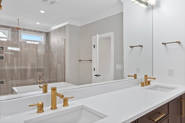 bathroom with crown molding, vanity, and a shower with shower door