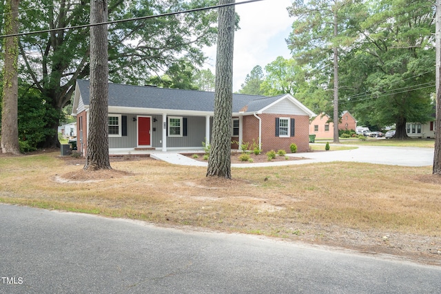 single story home with a front yard and a porch