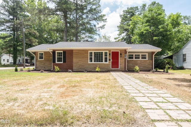 ranch-style house featuring a front lawn