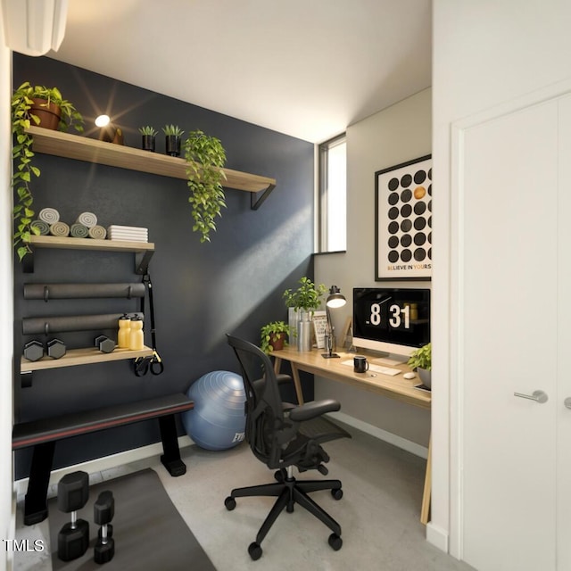 home office with concrete flooring