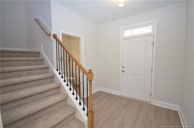 entrance foyer with light hardwood / wood-style flooring