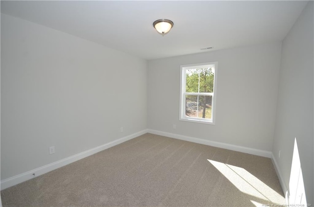 spare room featuring carpet floors