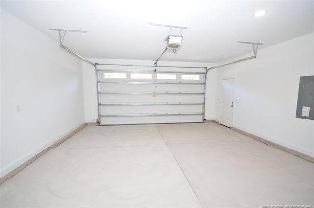 garage featuring a garage door opener and electric panel