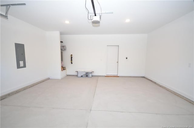 garage featuring a garage door opener and electric panel