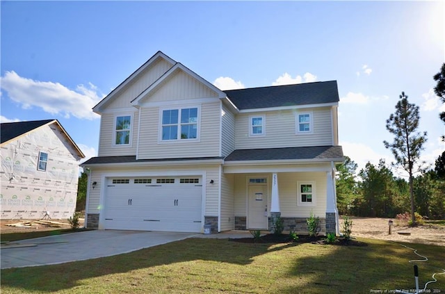 craftsman-style home with a garage and a front yard