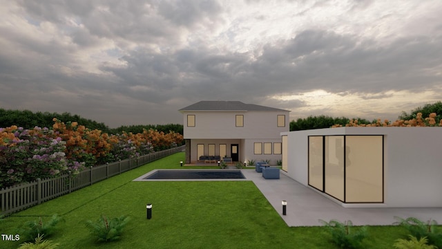 back of house with a yard, a patio, and a fenced backyard