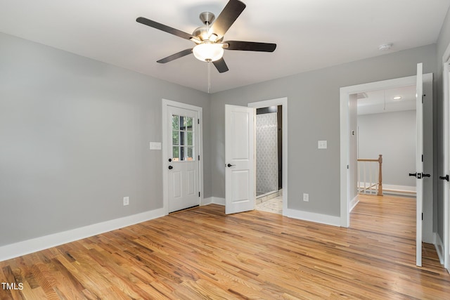 unfurnished bedroom with ceiling fan and light hardwood / wood-style floors