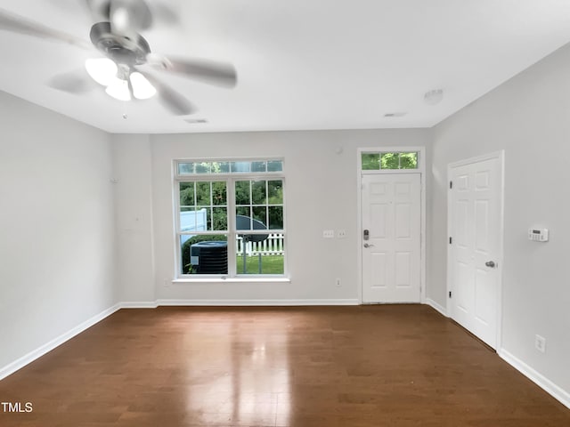 interior space featuring ceiling fan and dark wood-type flooring