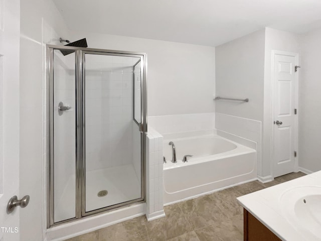 bathroom with tile patterned flooring, vanity, and plus walk in shower