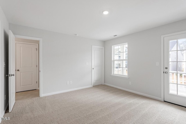 empty room with light colored carpet