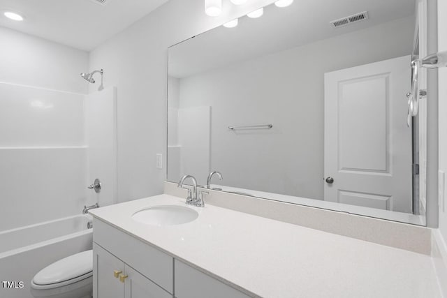 full bathroom with vanity, bathtub / shower combination, and toilet