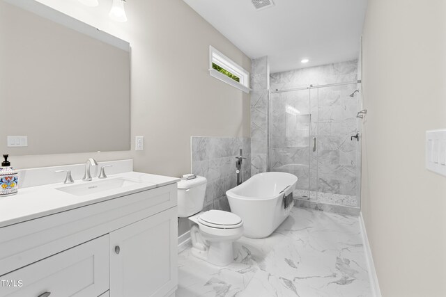 full bathroom featuring separate shower and tub, vanity, and toilet