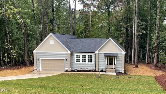 view of front of house featuring a garage and a front lawn