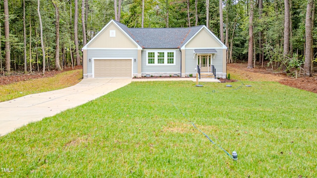 view of front of house featuring a front yard and a garage