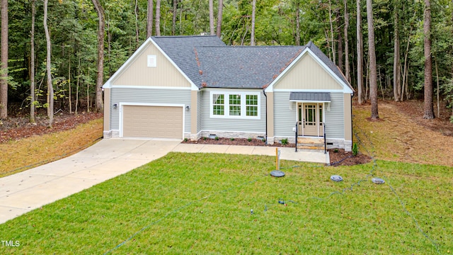 view of front of home with a garage and a front yard