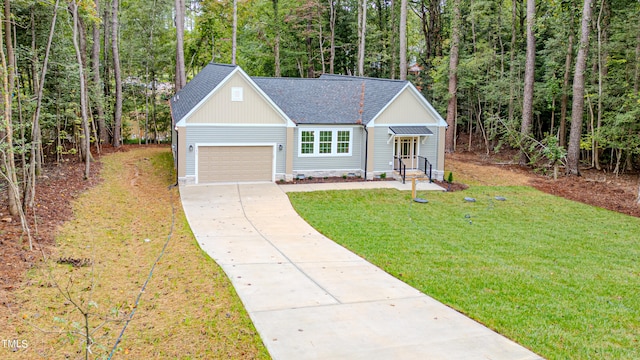 view of front of house with a front lawn and a garage