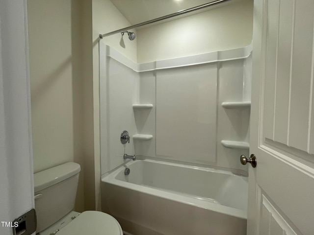 bathroom with toilet and shower / bath combination