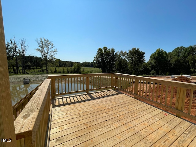 deck featuring a water view