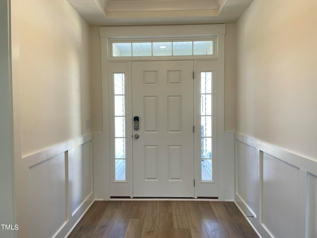 foyer with dark hardwood / wood-style floors