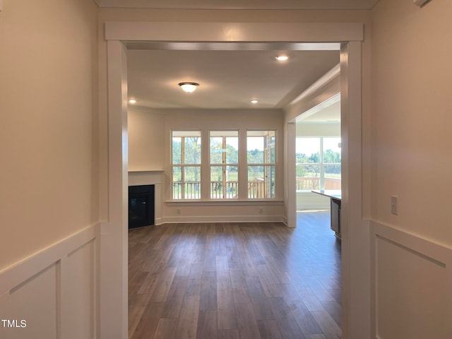 unfurnished living room featuring dark hardwood / wood-style floors