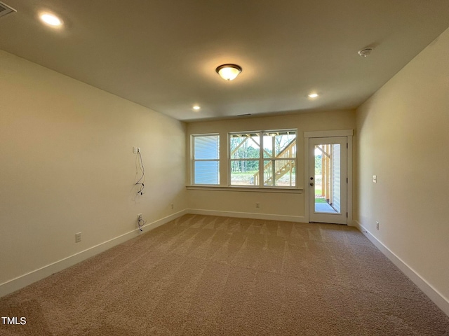 spare room featuring carpet