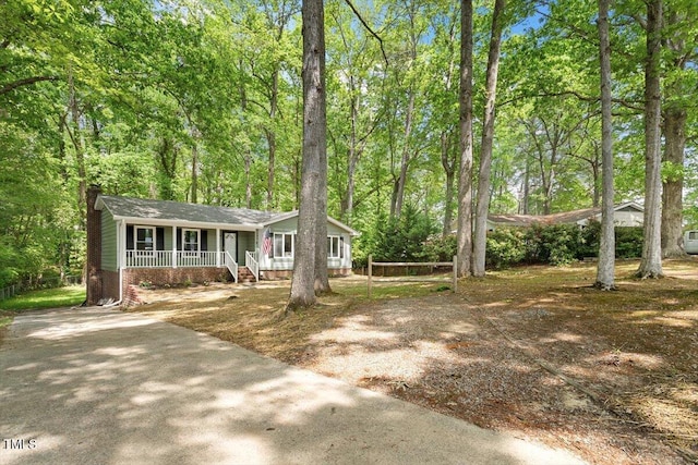 104 Argyle Ct, Garner, NC 27529 - view of front facade featuring a chimney and covered porch
