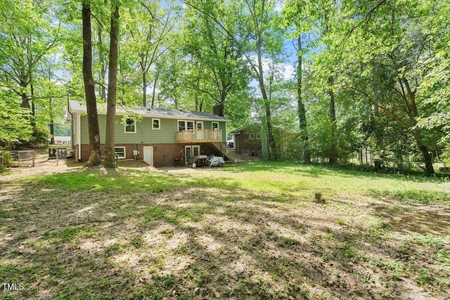 104 Argyle Ct, Garner, NC 27529 - view of yard with stairway and a wooden deck