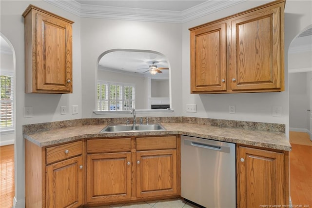 kitchen with ceiling fan, sink, a healthy amount of sunlight, stainless steel dishwasher, and ornamental molding