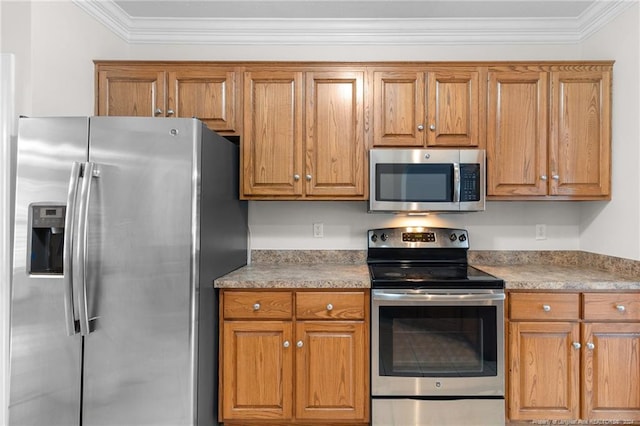 kitchen featuring stainless steel appliances and ornamental molding