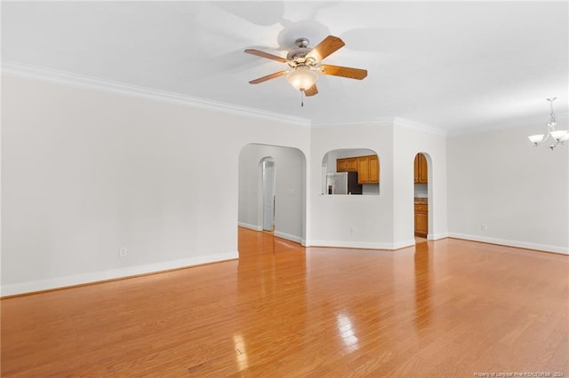 interior space featuring ceiling fan with notable chandelier, light wood-type flooring, and ornamental molding